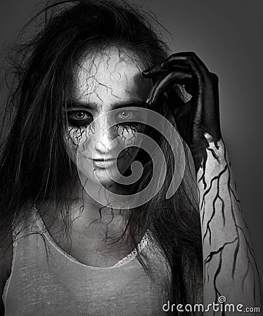 Black and white portrait of a girl with black eyes and black veins. madness and obsession with spirits. concept of halloween and d Stock Photo