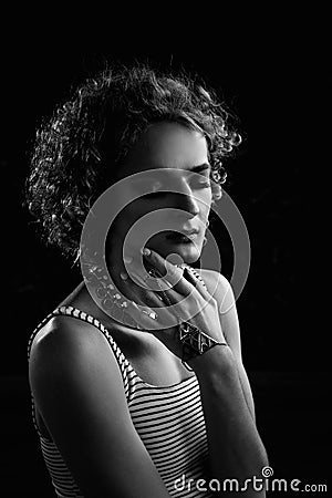 Portrait of a young guy androgyne model in the image of a woman. Stock Photo