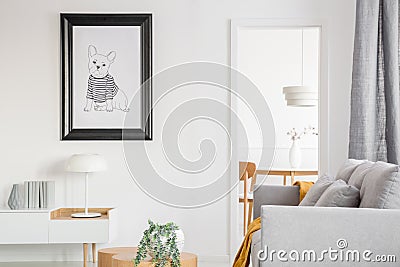 Black and white poster of dog on the wall of fashionable living room interior Stock Photo