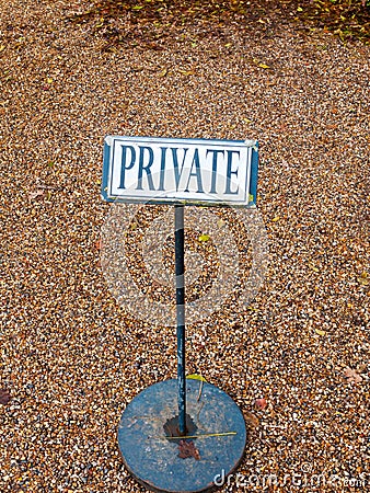 Black and white private sign post metal cobble floor Stock Photo