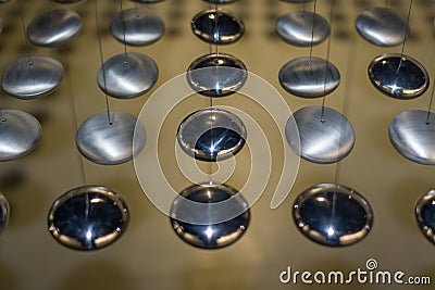 Black and white rounded shinny metal circles suspended in the air Stock Photo