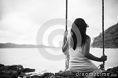 Black and white of Sad and lonely woman sitting alone Stock Photo
