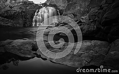 Black and white shot of a small waterfall in Litchfield National Park in Western Australia Stock Photo