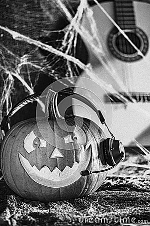 Laughing pumpkin in headphones Stock Photo