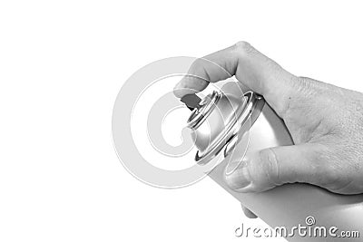 Black and white spray can with finger pushing the button Stock Photo