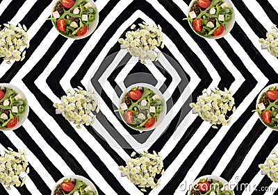 Black and white stripe background plate salad tomatoes arugula chrysanthemum flowers Stock Photo