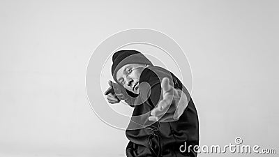 Black and white stylish modern epic portrait of bboy on a white background. Breakdance and hiphop dancer. Mysterious and Stock Photo