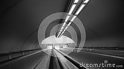 Black and white subway escalators in deep perspective Stock Photo