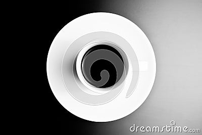 Black and white symmetry, top view of cup of black coffee Stock Photo