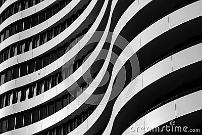 Black and white tone,curvature facade with black windows and white aluminium panels in wavy shape. Stock Photo