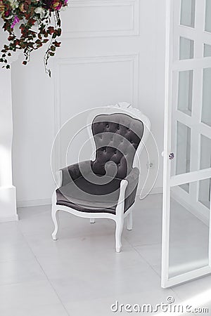 Black and white velours vintage armchair in minimalistic scandinavian room. vertical photo with clear space for text Stock Photo