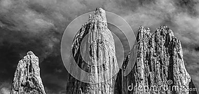 A black and white view of the three huge granite towers at the end of the W walk in Torres del Paine National Park Stock Photo