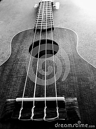 Black and white wooden guitar. Stock Photo