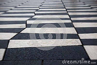 Black and white zigzag zebra tile road crosswalk background with bokeh Stock Photo