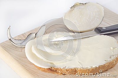 Black winter radish on a slice of bread Stock Photo