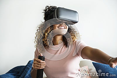 Black woman experiencing virtual reality with VR headset Stock Photo