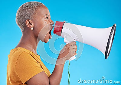Black woman, megaphone and shout in studio, protest and profile with noise for human rights by blue background. African Stock Photo