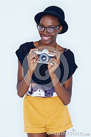 Black woman, photographer and positive in studio with camera, creativity and media for artist with creative talent Stock Photo