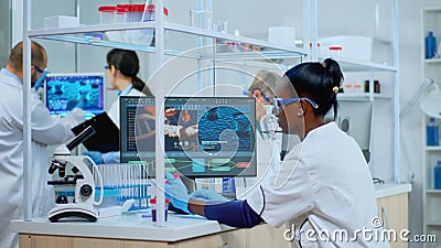 Black woman researcher carrying out scientific research in lab Stock Photo