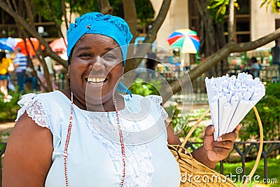 Black woman selling roasted peanuts in Havana Editorial Stock Photo