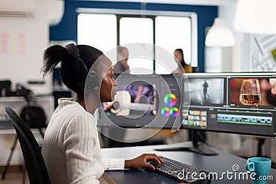 Black woman video editor developing new project film montage Stock Photo