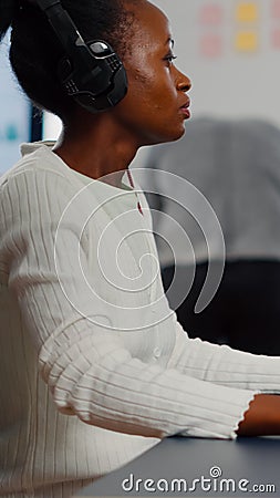 Black woman video editor editing new project film montage Stock Photo