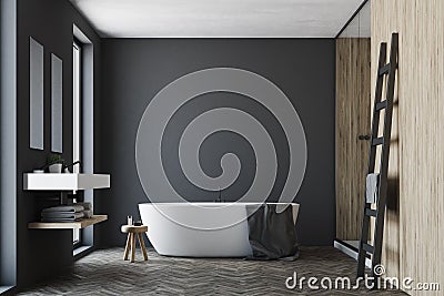 Black and wooden bathroom, white tub Stock Photo