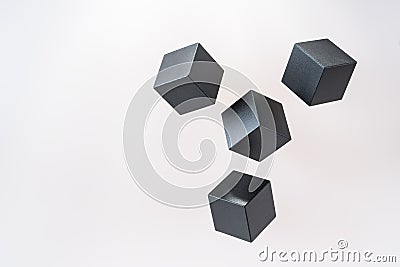 Black wooden cube shapes are floating. Stock Photo