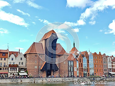 Black wooden medieval crane building on the Gdansk waterfront Editorial Stock Photo