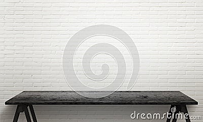 Black wooden table with legs. White brick wall texture in background Stock Photo