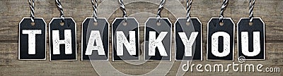 Black tags on natural wood with Thank you Stock Photo