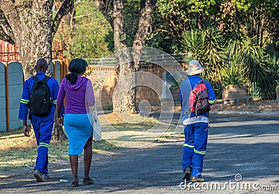 Black workers walk to their jobs in South Africa Editorial Stock Photo
