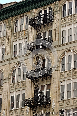 Black wrought ironl fire escape on apartment building, Manhattan Stock Photo