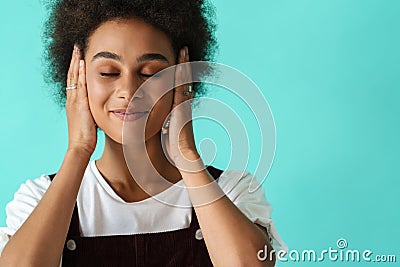 Black young woman wearing rings covering her ears Stock Photo