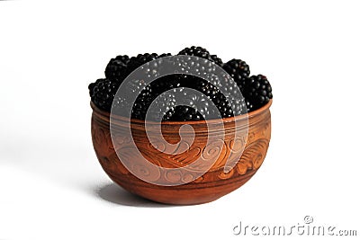Blackberry berries in pottery isolated on white Stock Photo