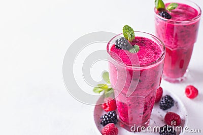 Blackberry and raspberry smoothies in glass with mint leaf and r Stock Photo