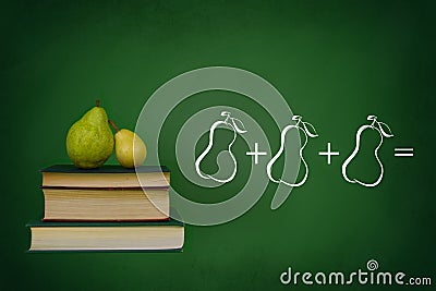 Blackboard, books and pears Stock Photo