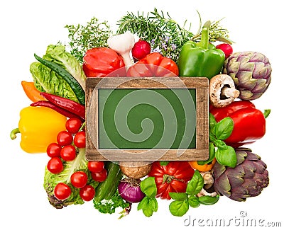 Blackboard with fresh organic vegetables and herbs Stock Photo