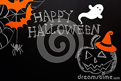 Blackboard Halloween background with chalked pumpkin, ghost, spiders and bats. Copy space for text. Stock Photo