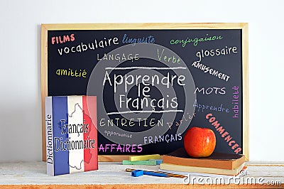 Blackboard with the message LEARN FRENCH Stock Photo