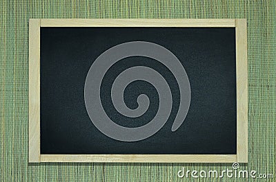 Blackboard on the natural hemp mat Stock Photo