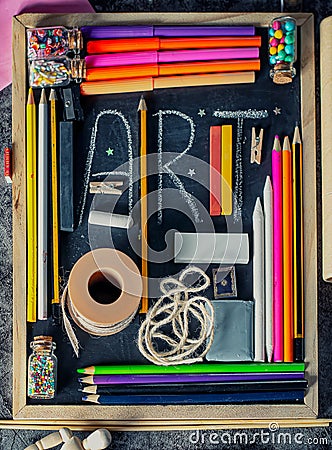 Blackboard with various art and craft tools Stock Photo