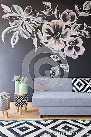 Blackboard wall with flowers Stock Photo