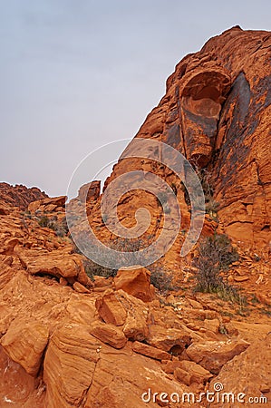 Blackened wedge of red rock, Valley of Fire, Nevada, USA Stock Photo