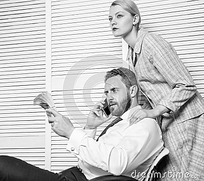 Blackmail and money extortion. Illegal money profit concept. Man speak mobile phone ask for money. Accomplices financial Stock Photo