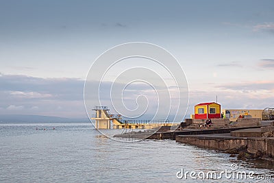 Blackrock public diving board. Salthill beach, Galway city, Ireland. Popular town landmark and swimming place. Calm morning light Editorial Stock Photo