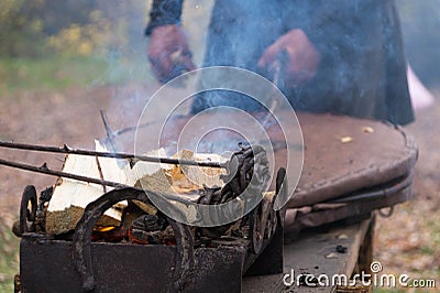 Blacksmith craft: blacksmith pumping furs Editorial Stock Photo