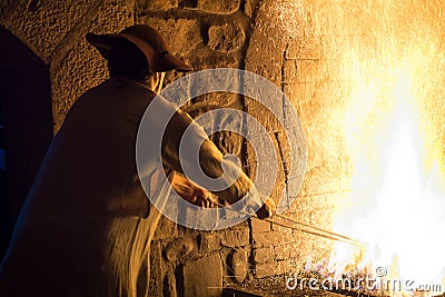 .Blacksmith forging in the traditional way, as in the past Editorial Stock Photo