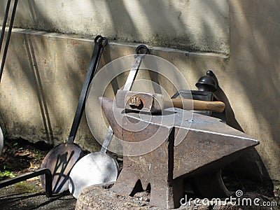 Blacksmith hammer resting on the anvil Stock Photo