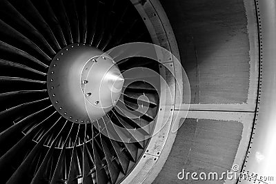 Blades of an aircraft engine close-up. Travel and aerospace concept. Black and white filter Stock Photo